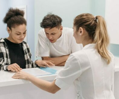 hospital-receptionist-with-patient