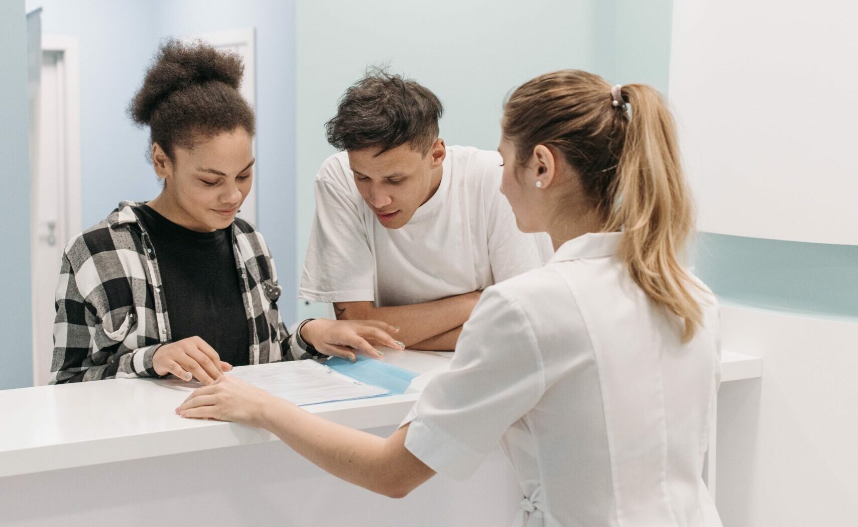 hospital-receptionist-with-patient